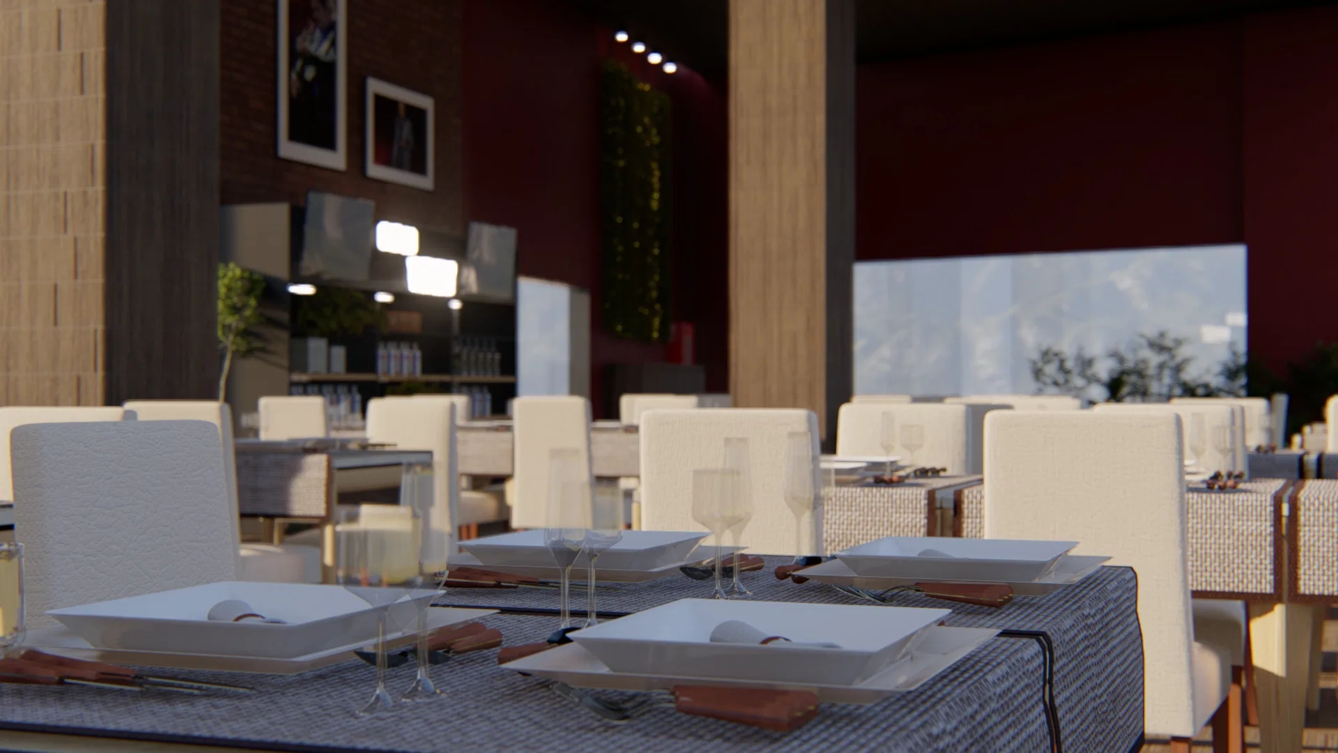 Indoor dining hall with white place settings, pale chairs and a wine-red wall with photos, a vertical garden and mountain view.