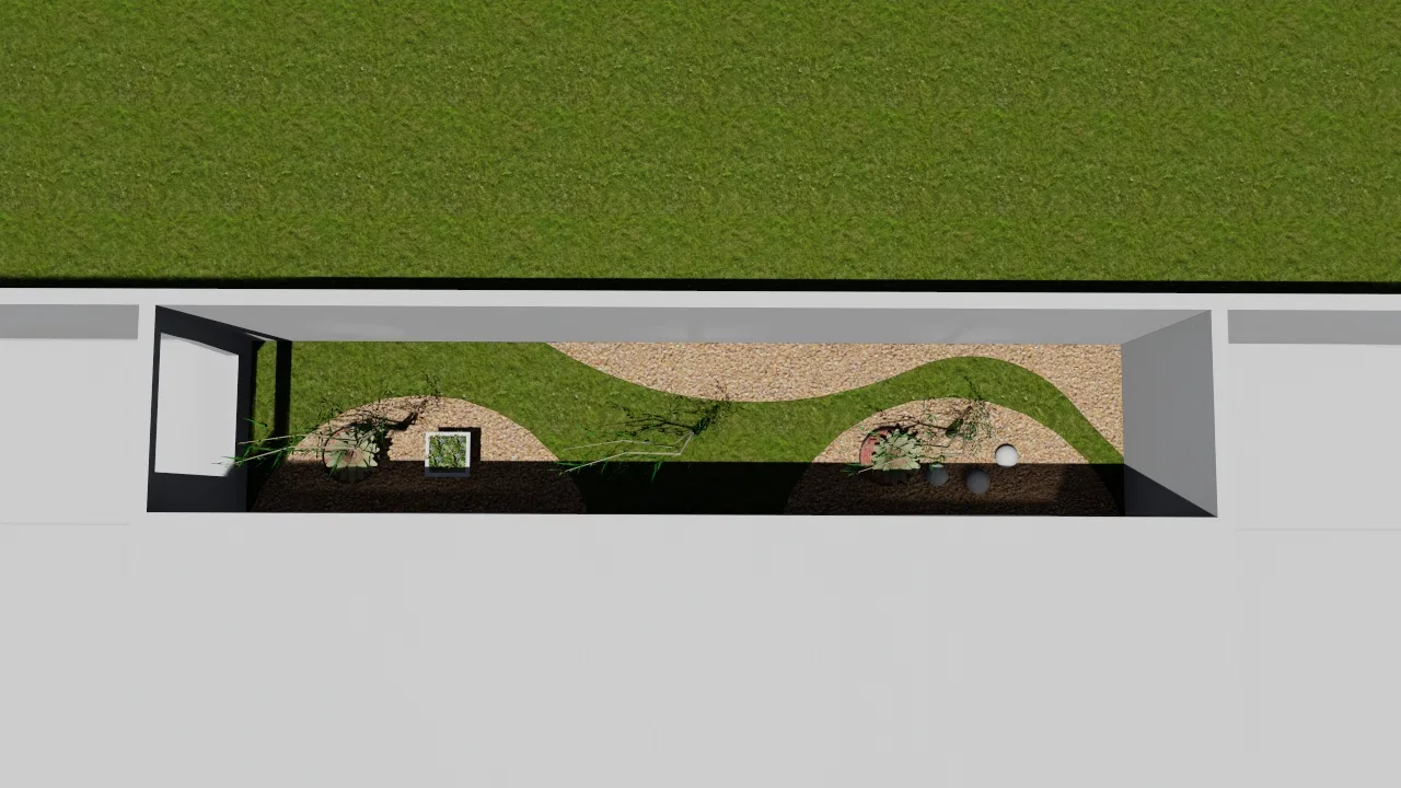 Overhead view of the narrow bed revealing the sinuous line of the gravel path between dark soil and the strip of lawn.