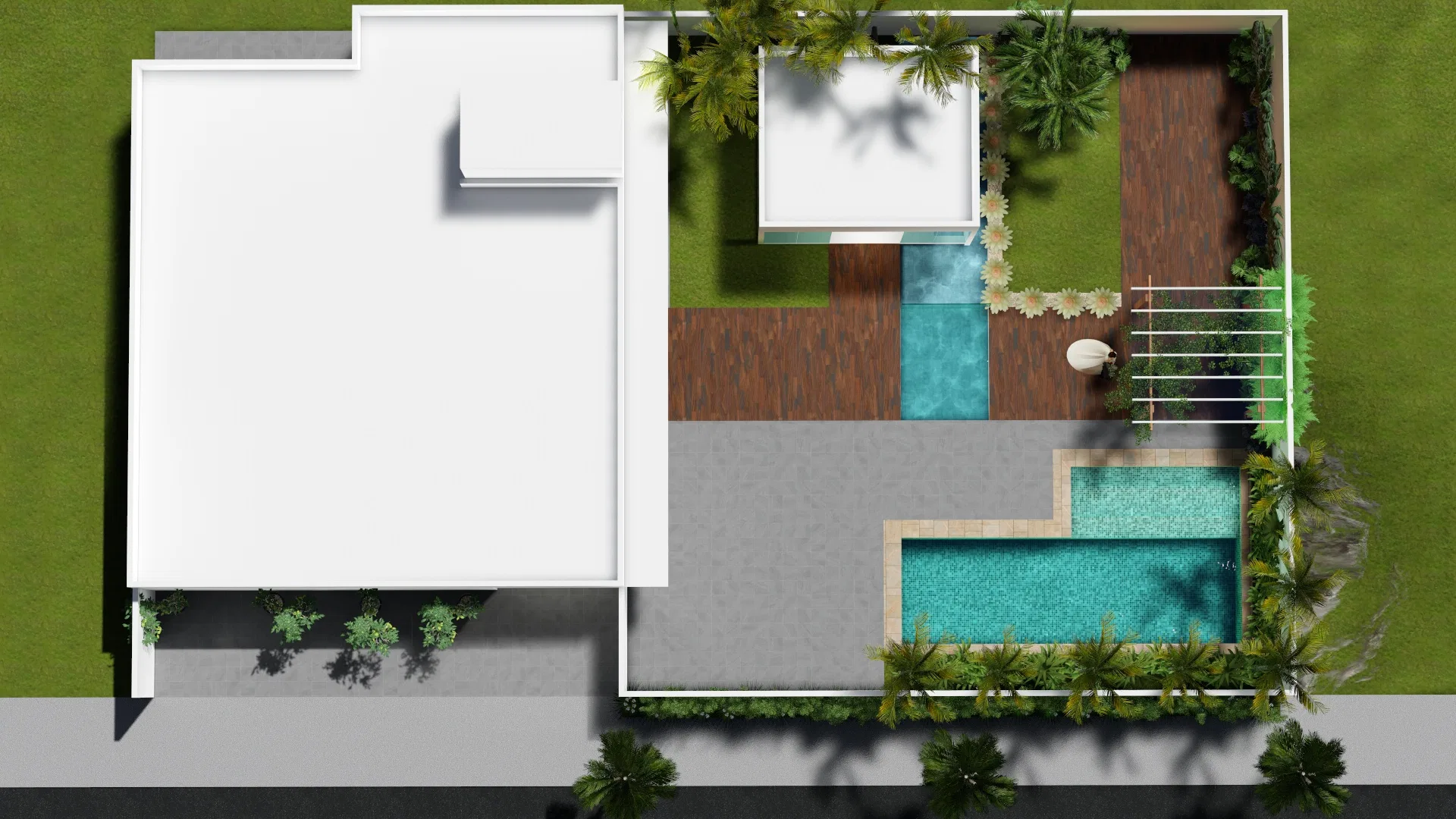 Aerial view of the property showing the house roof, wooden decks, two pool sections and planting beds running along the walls
