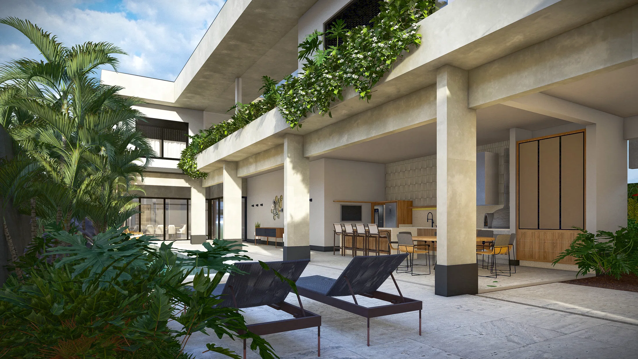 Double-height outdoor kitchen area with a flowering vertical garden on the slab, an outdoor kitchen and loungers by the patio