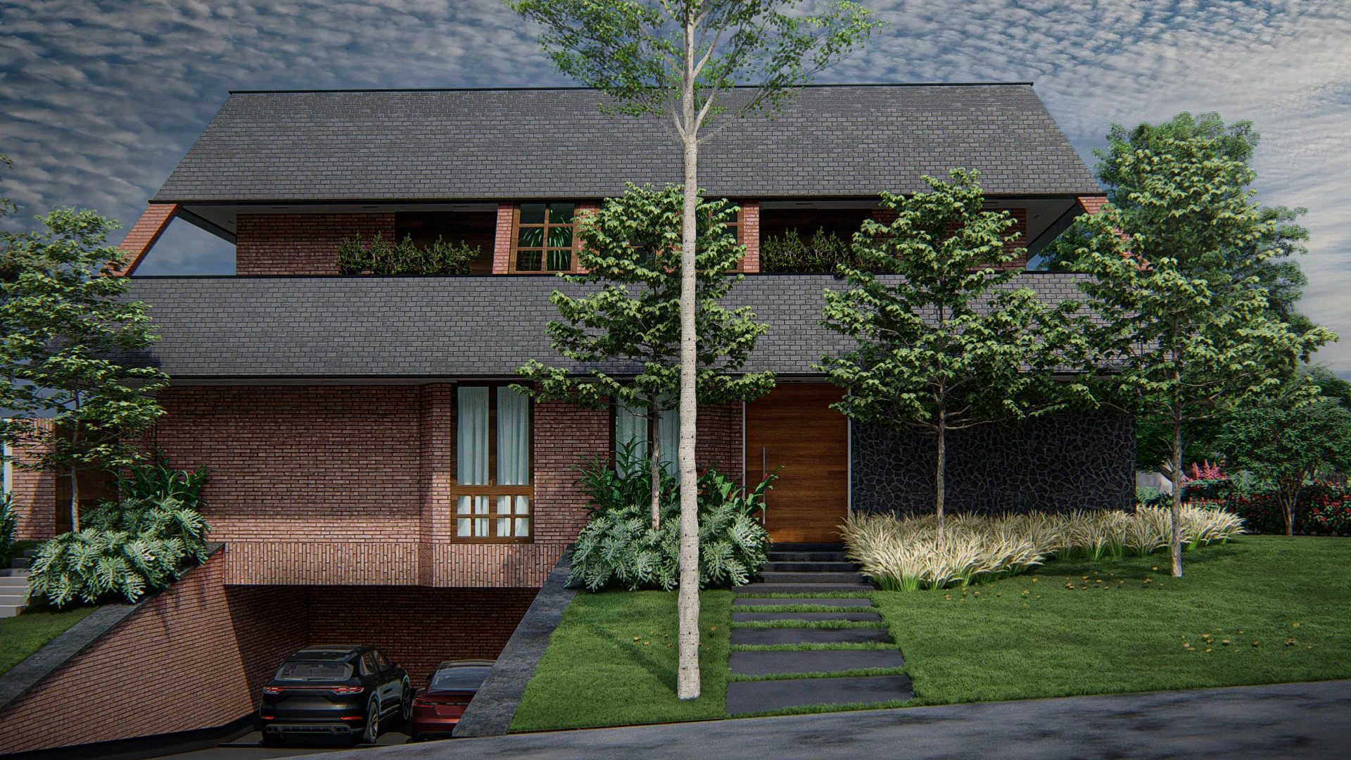 Brick house facade with a sloped roof, a tree near the entrance and a stone stairway lined with ornamental grasses