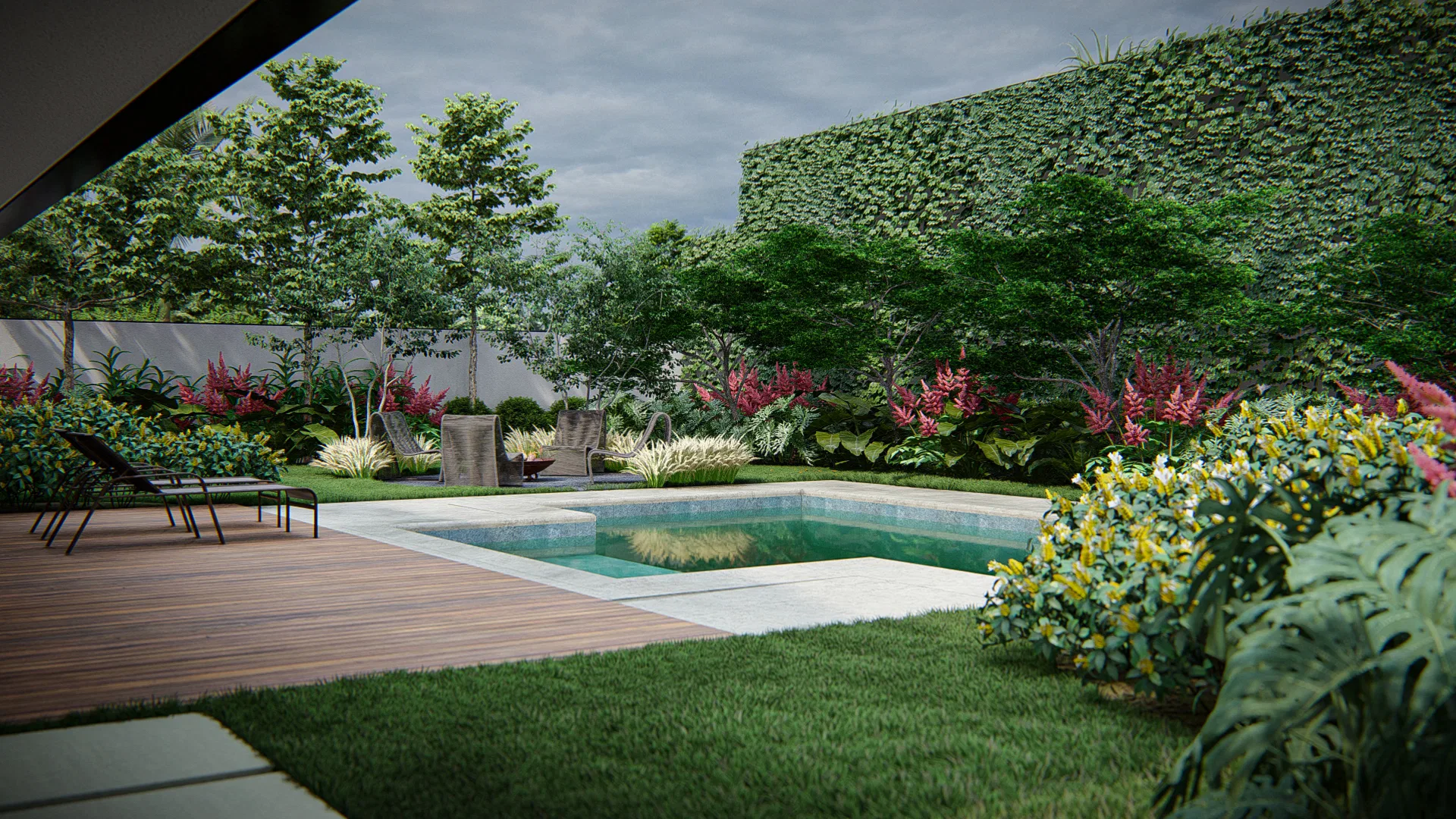 Pool with a wood deck and lounge chairs, an ivy-covered wall behind and flowering beds around it