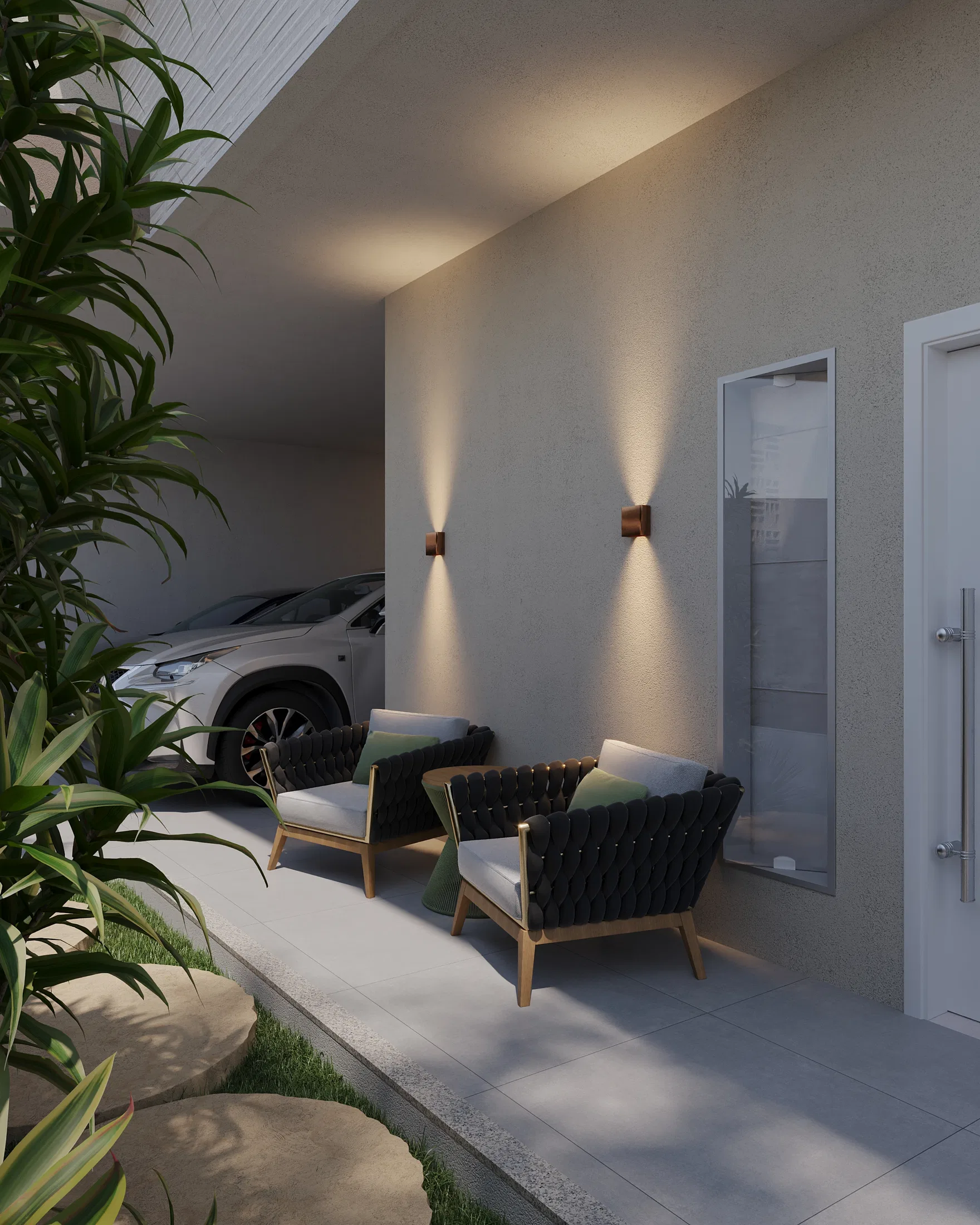 Outdoor seating area with two black woven-fiber armchairs, vertical wall sconces and a garage space with a car in the background