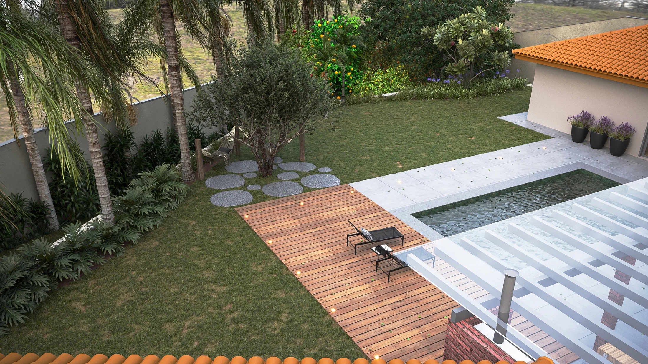 Aerial view of the backyard with pool, timber deck and low table, palms, an olive tree and circular pavers cutting across the lawn.