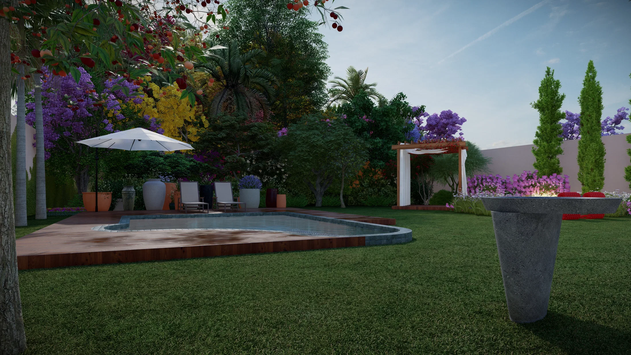 Pool by day with timber deck, umbrella and lounge chairs, flowering trees all around and a conical fire bowl set on the lawn.