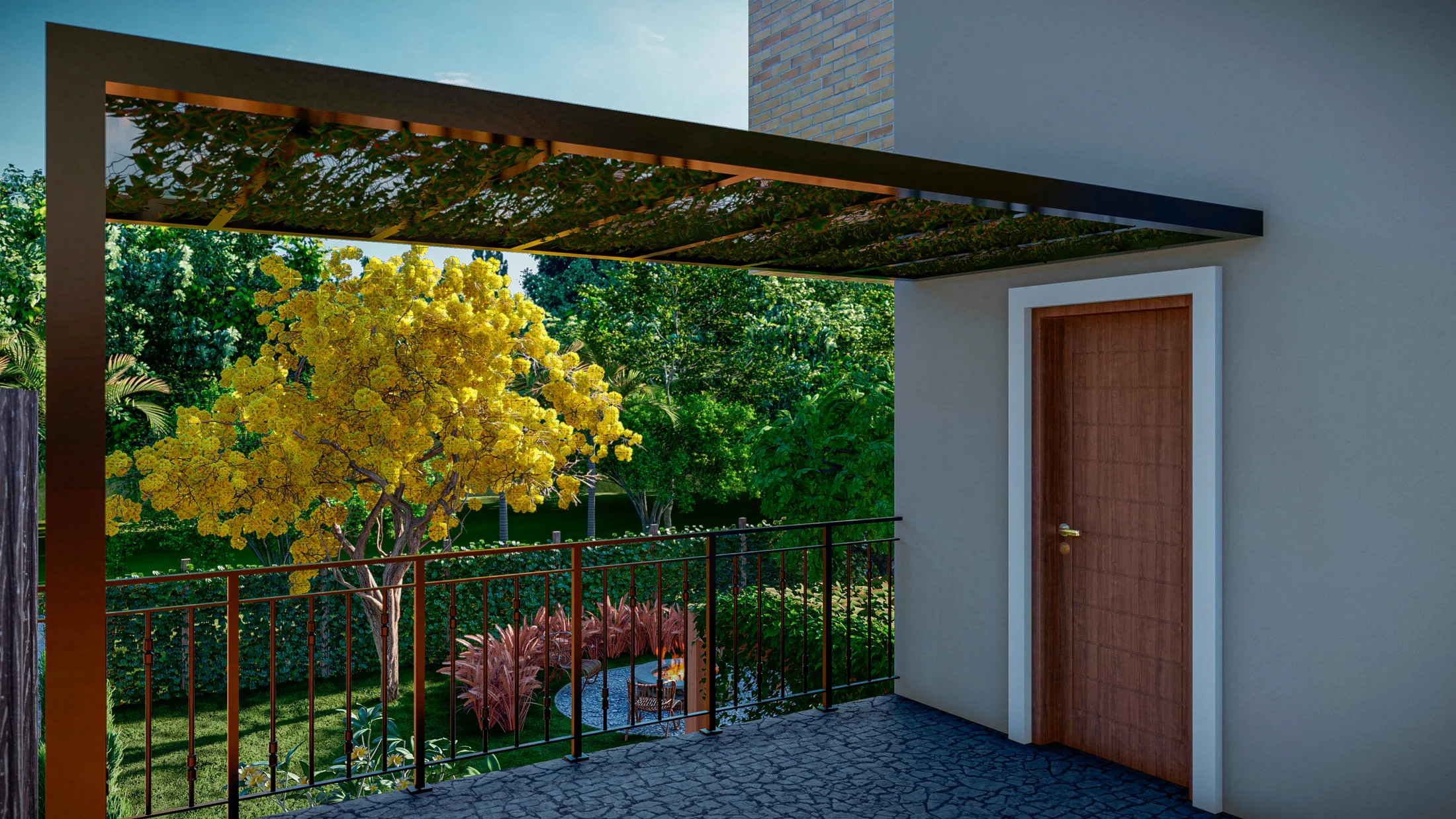 View under a metal pergola with climbing vines, a yellow-flowering tree and a bed of red foliage in the background