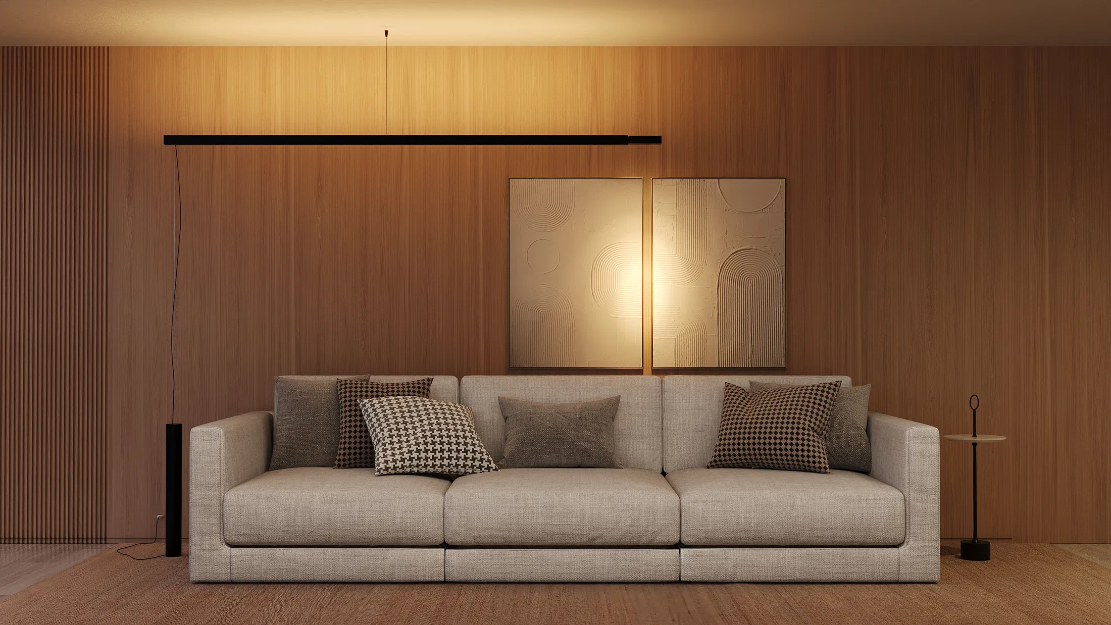 Living room with a light-linen sofa, patterned cushions and two abstract framed artworks, beneath a horizontal suspended light line by the wood wall.