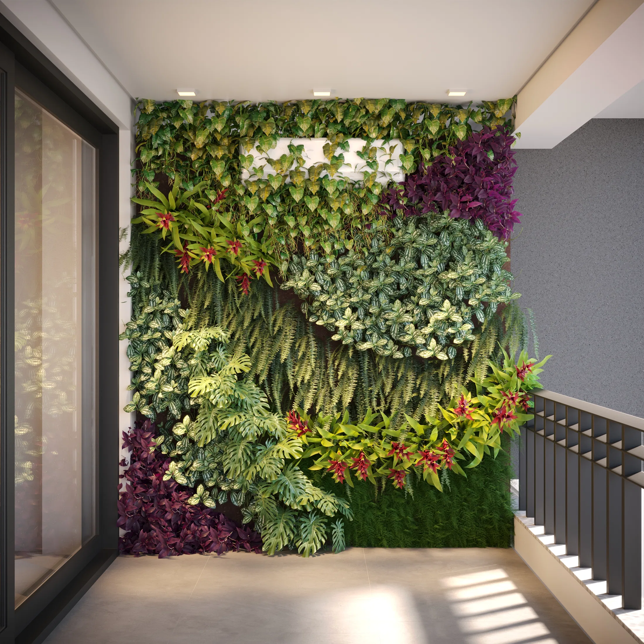 Full-height vertical garden of tropical foliage and red bromeliad blooms lining an interior landing beside a staircase and a tall glass door