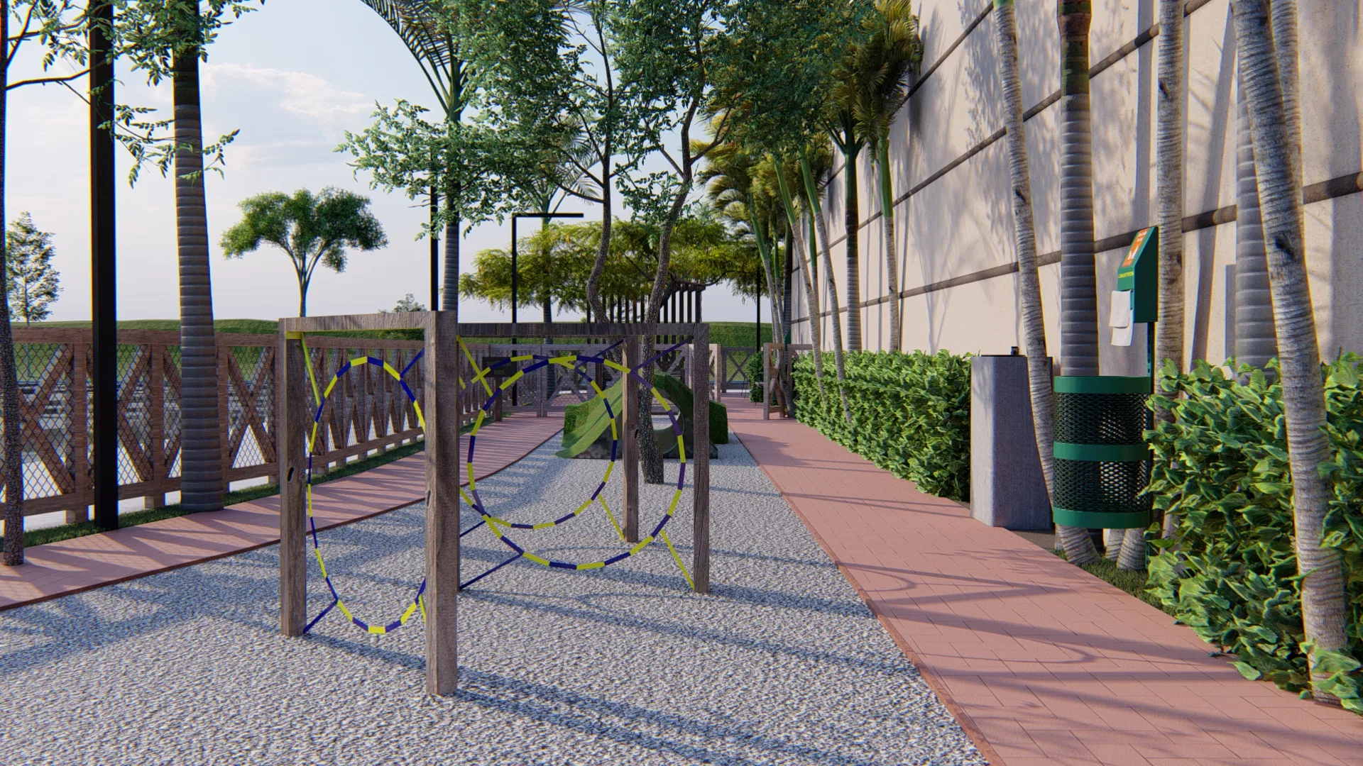 Agility course section with blue-and-yellow rope obstacles on a gravel bed, a green ramp and a waste station beside the mall's clipped hedge