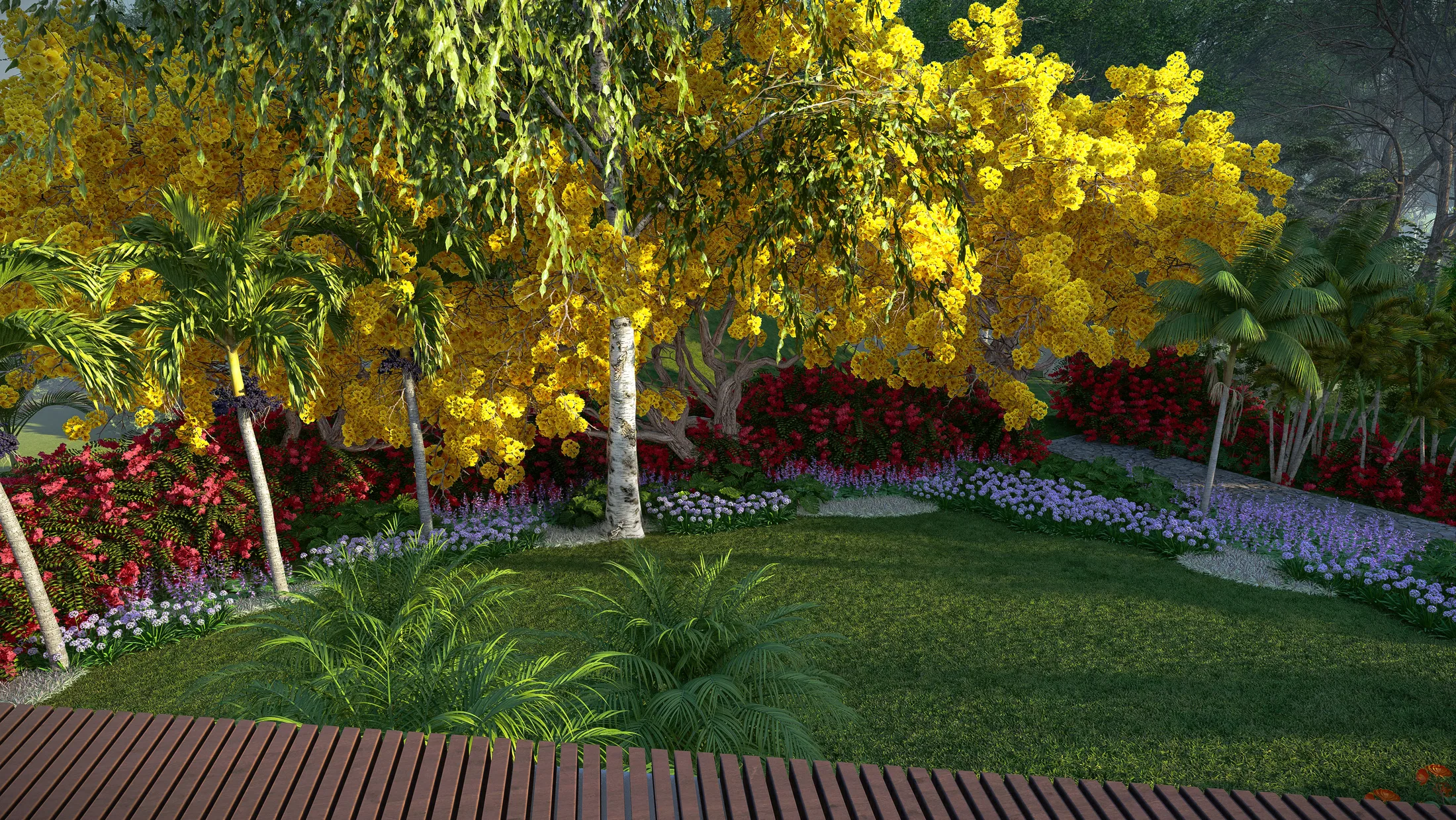 Wood deck beneath a flowering yellow ipe canopy, with beds of red and purple flowers behind.
