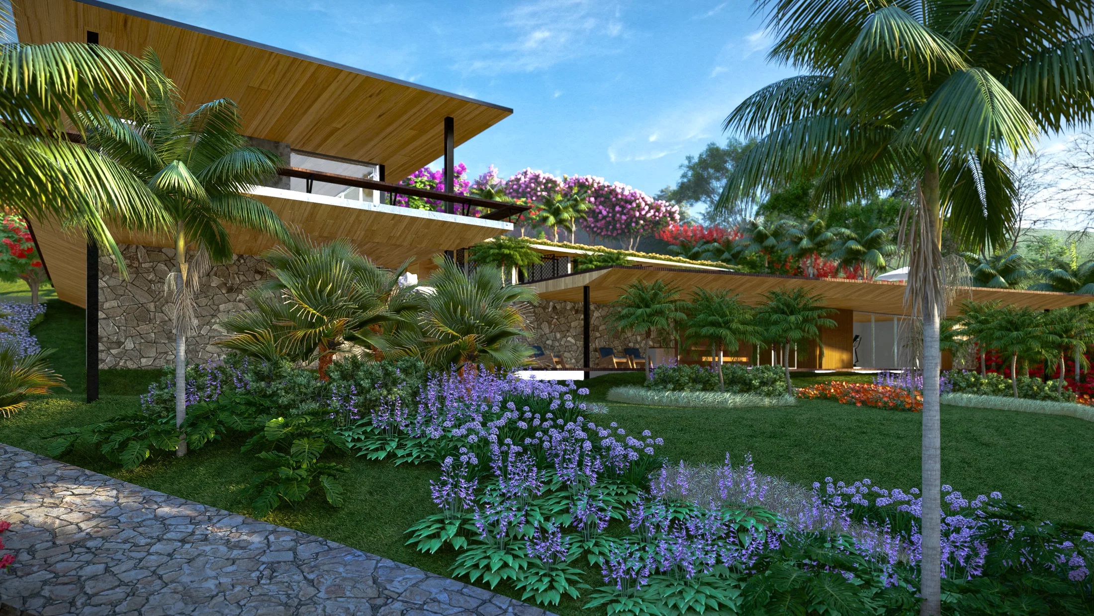 Side view of the house with a wood pergola, a stone-clad base wall and a bed of purple flowers beside a palm tree.
