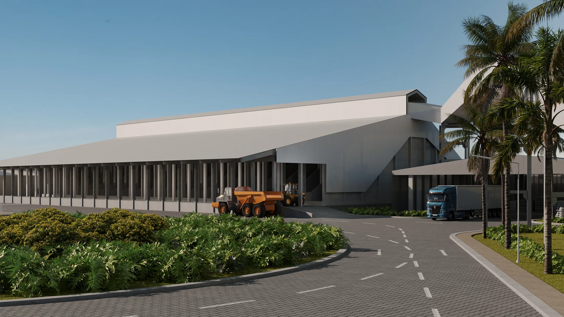 Long warehouses with a white folded roofline, a curving access road, palm trees and a haul truck beside the loading area.