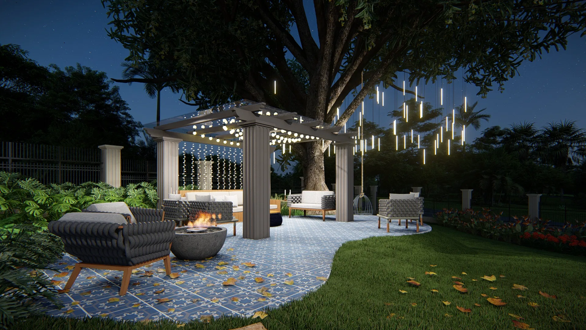 Nighttime lounge beneath a pergola, pendant lighting strung through the tree branches, woven-fiber armchairs and a tabletop fire bowl on checkered tile