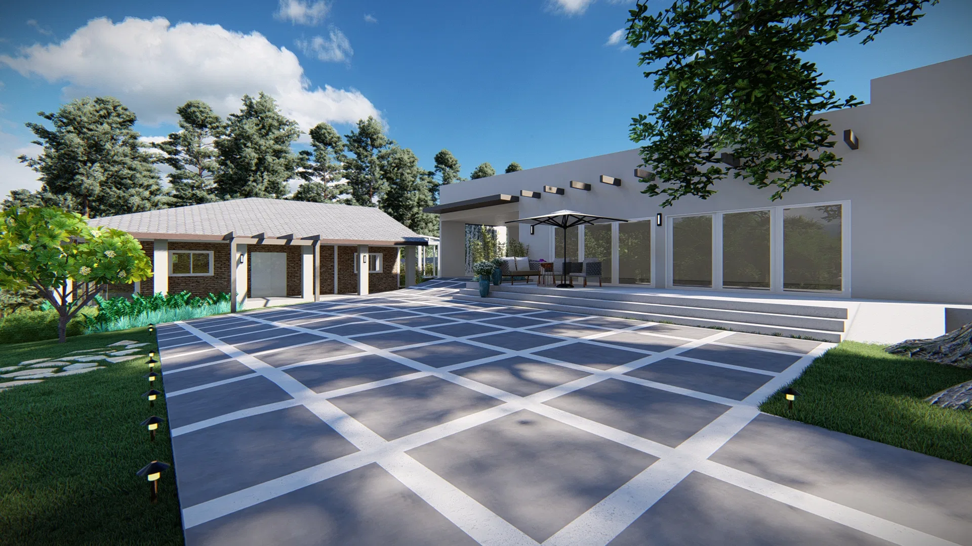 Entry driveway in a gray geometric paving pattern leading to the garage and a covered seating area by the house facade
