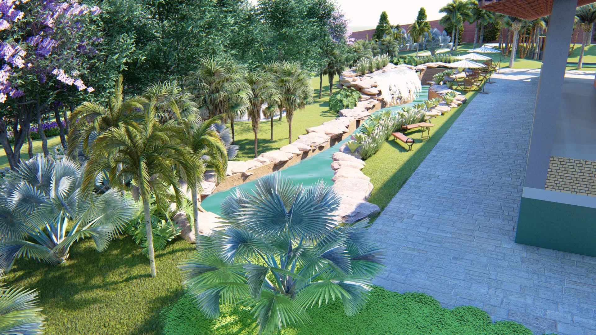 Rock-edged water channel between blue and imperial palms, a purple-flowering tree, benches at the edge and a broad walkway leading to the pergola
