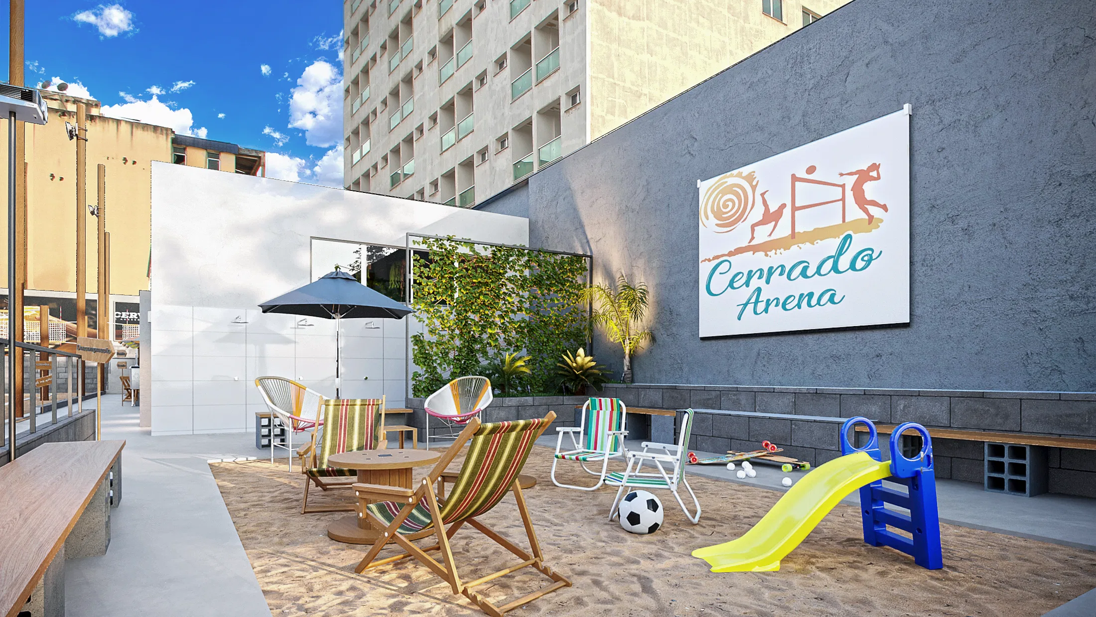 Kids area on sand, with striped deck chairs, colorful chairs, a small slide, a ball and the Cerrado Arena sign on the block wall