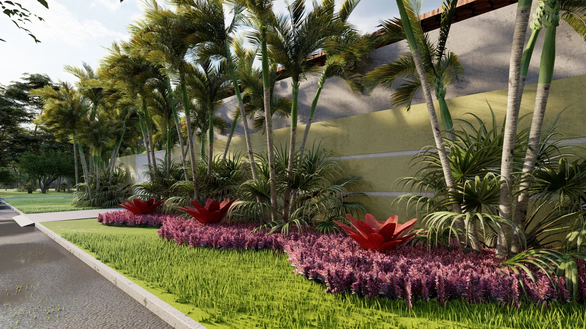 Side path beneath tall palm trees, lined with pink and purple flowers and red bromeliads along the wall.