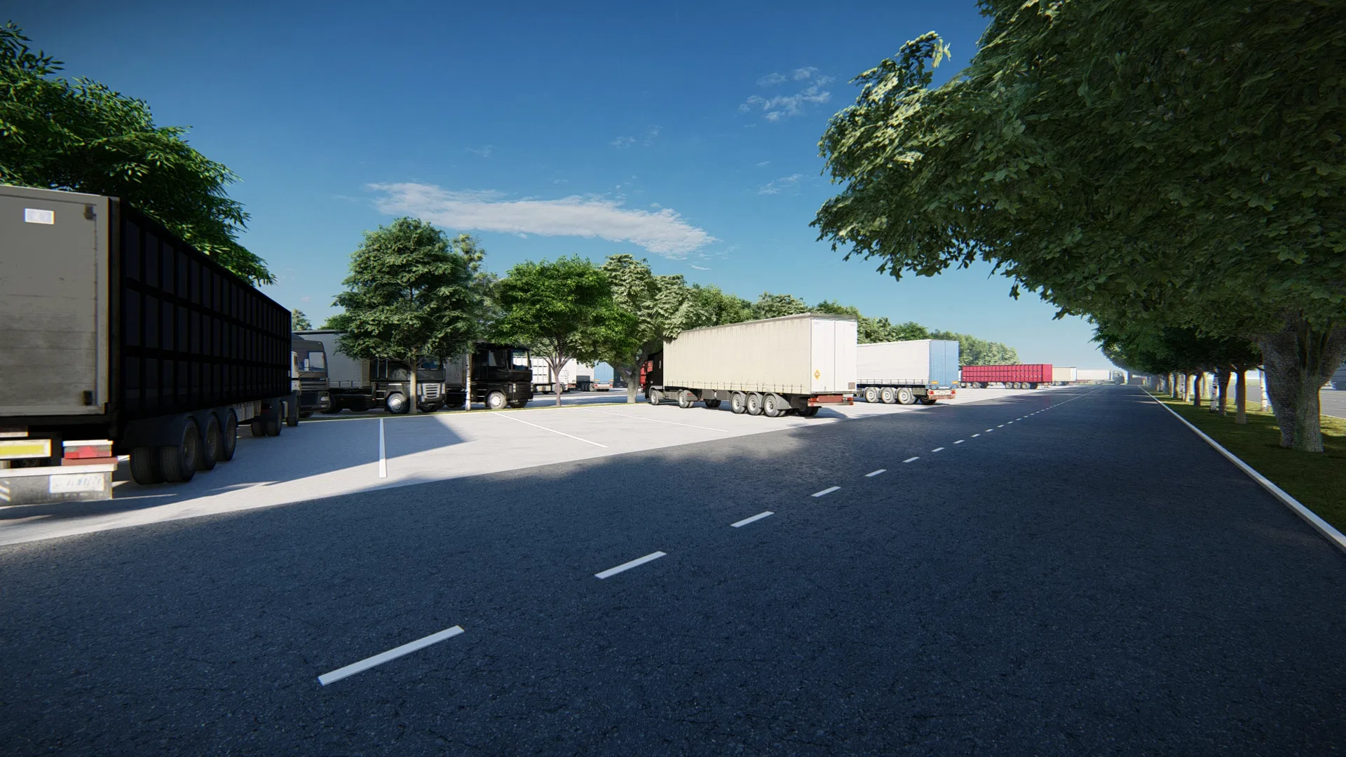Asphalt yard with semi-trailers and trucks parked in a row, trees lining the roadway and a clear blue sky