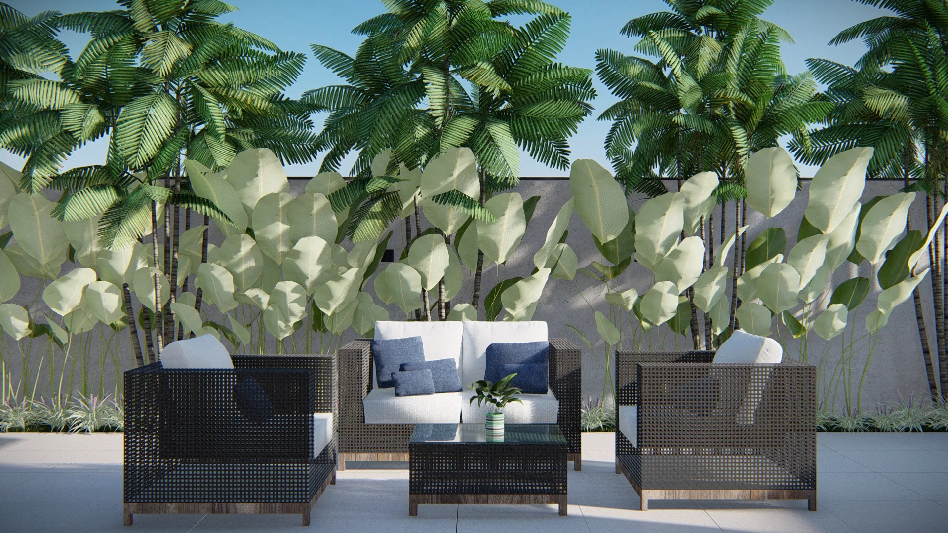Outdoor lounge with dark woven armchairs and sofa and blue cushions, against a backdrop of strelitzias and palms by the wall