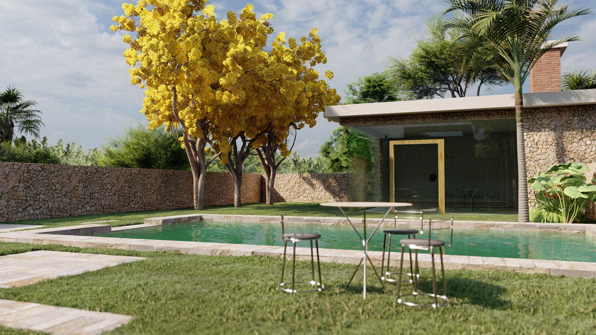 Pool with a stone wall and yellow-flowering trees behind it, high tables with stools set on the lawn