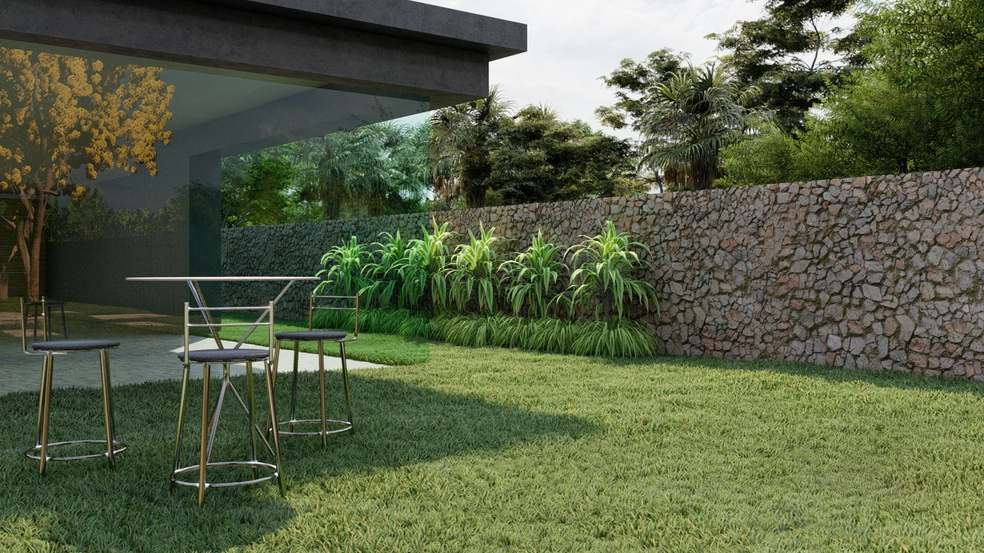 Covered area with glass walls beside a stone wall and an ornamental grass bed on the lawn