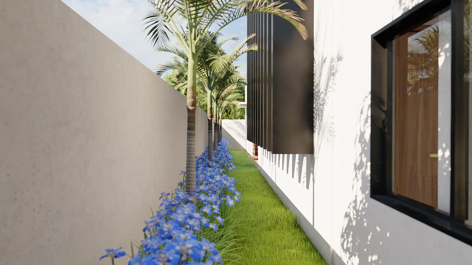 Side passage between the wall and a white façade with a black vertical brise, a strip of grass, a bed of blue flowers and a row of palms