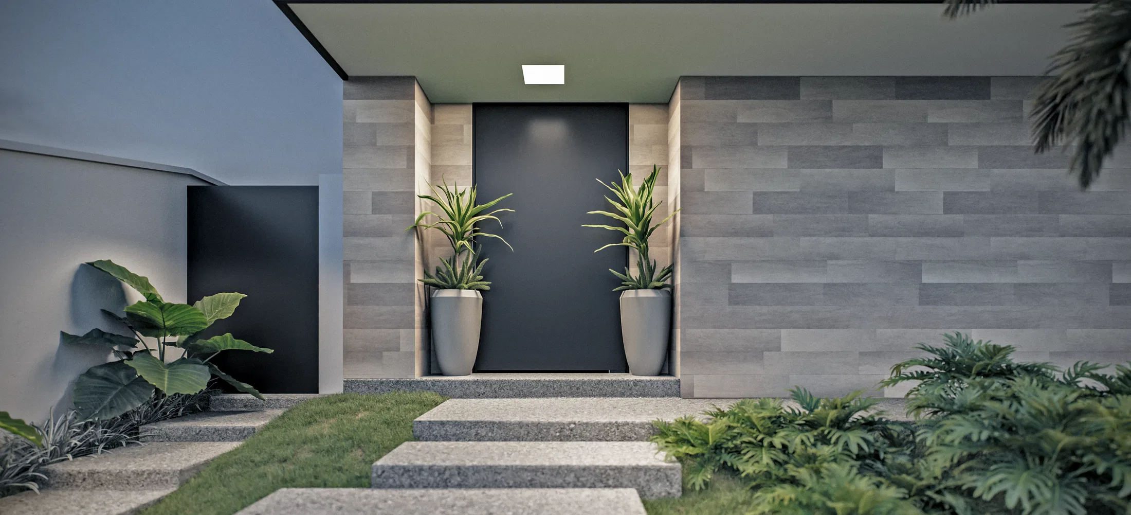 Detail of the dark door recessed in a stacked-stone wall, with two dracaenas in pale pots and tropical foliage on either side.