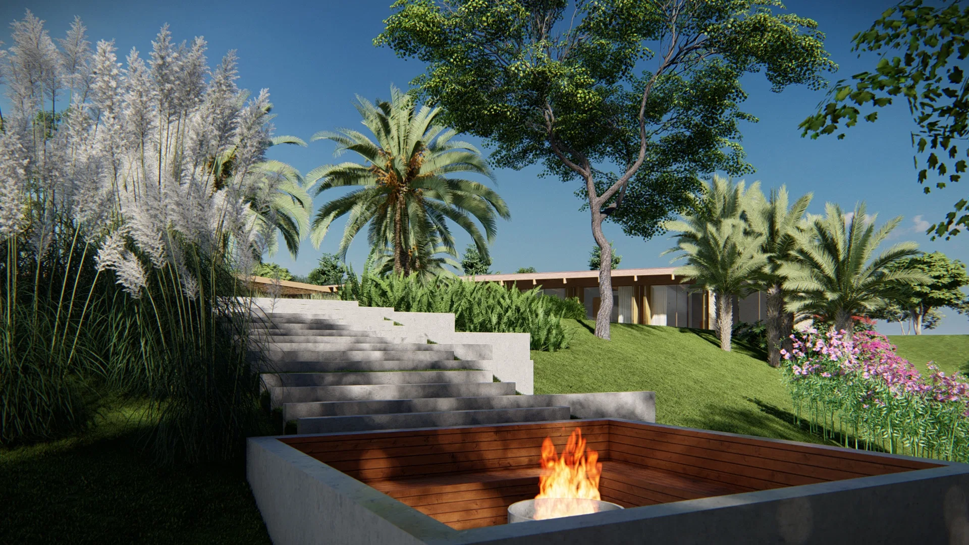 Sunken fire-pit lounge in concrete and timber, with a lit flame, beside steps rising up the lawn among palms and pampas grass.