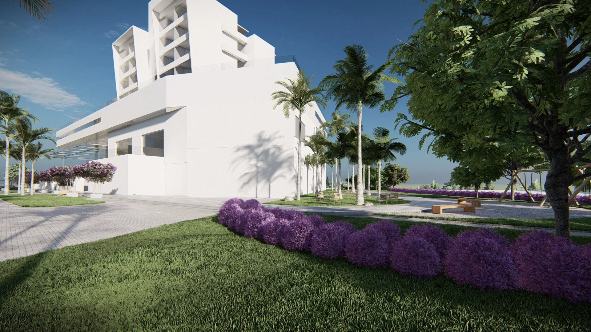 Row of spherical lilac shrubs on a trimmed lawn, set before the sculptural white volume framed by coconut palms.
