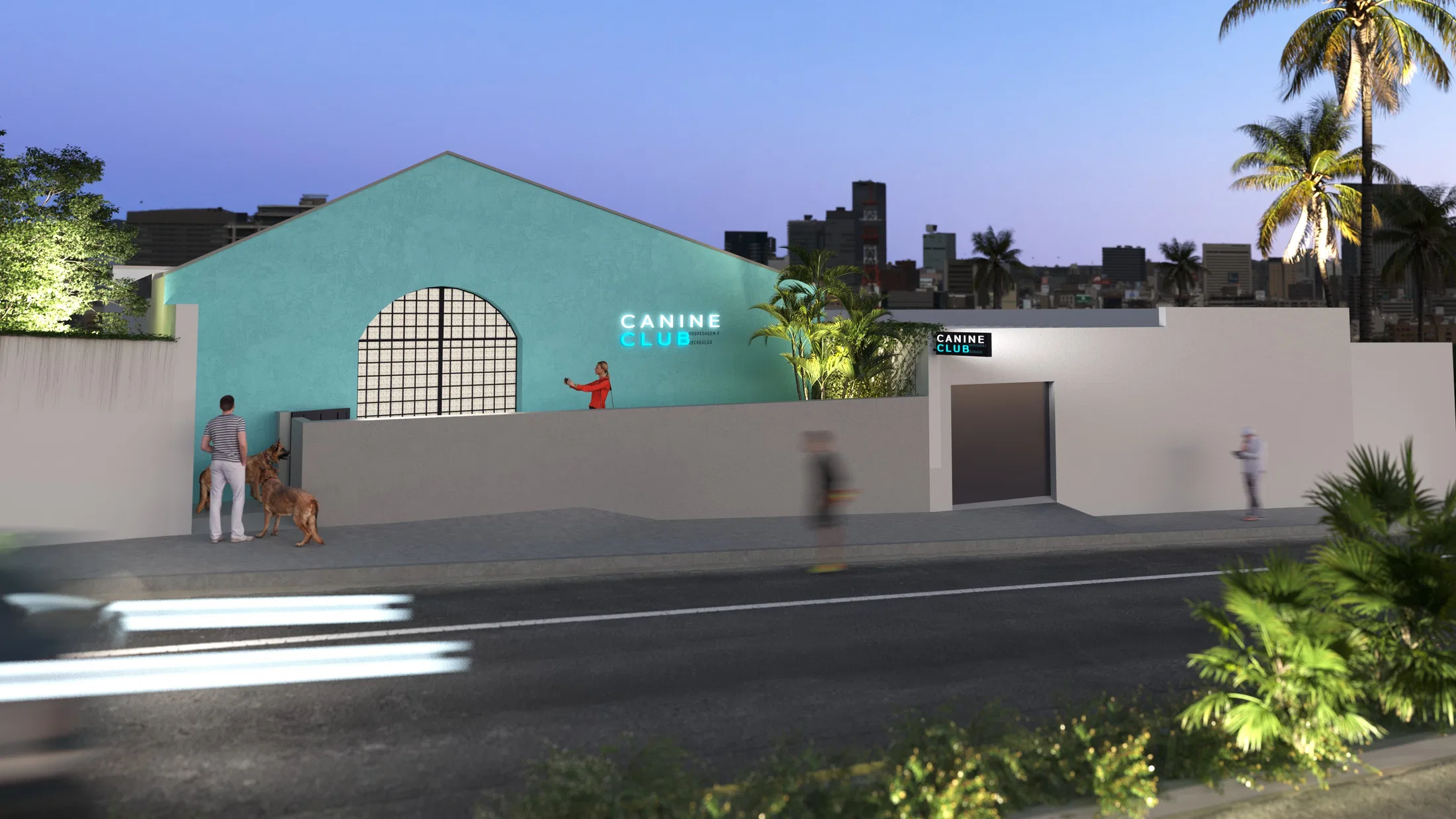 Turquoise facade at dusk, with an arched gable, illuminated brand sign, white wall and a person walking two dogs along the pavement.