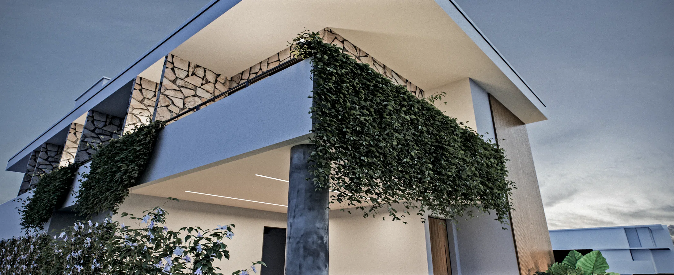 Close view of the upper volume in stone cladding, with a cantilevered balcony wrapped in dense hanging greenery at dusk.
