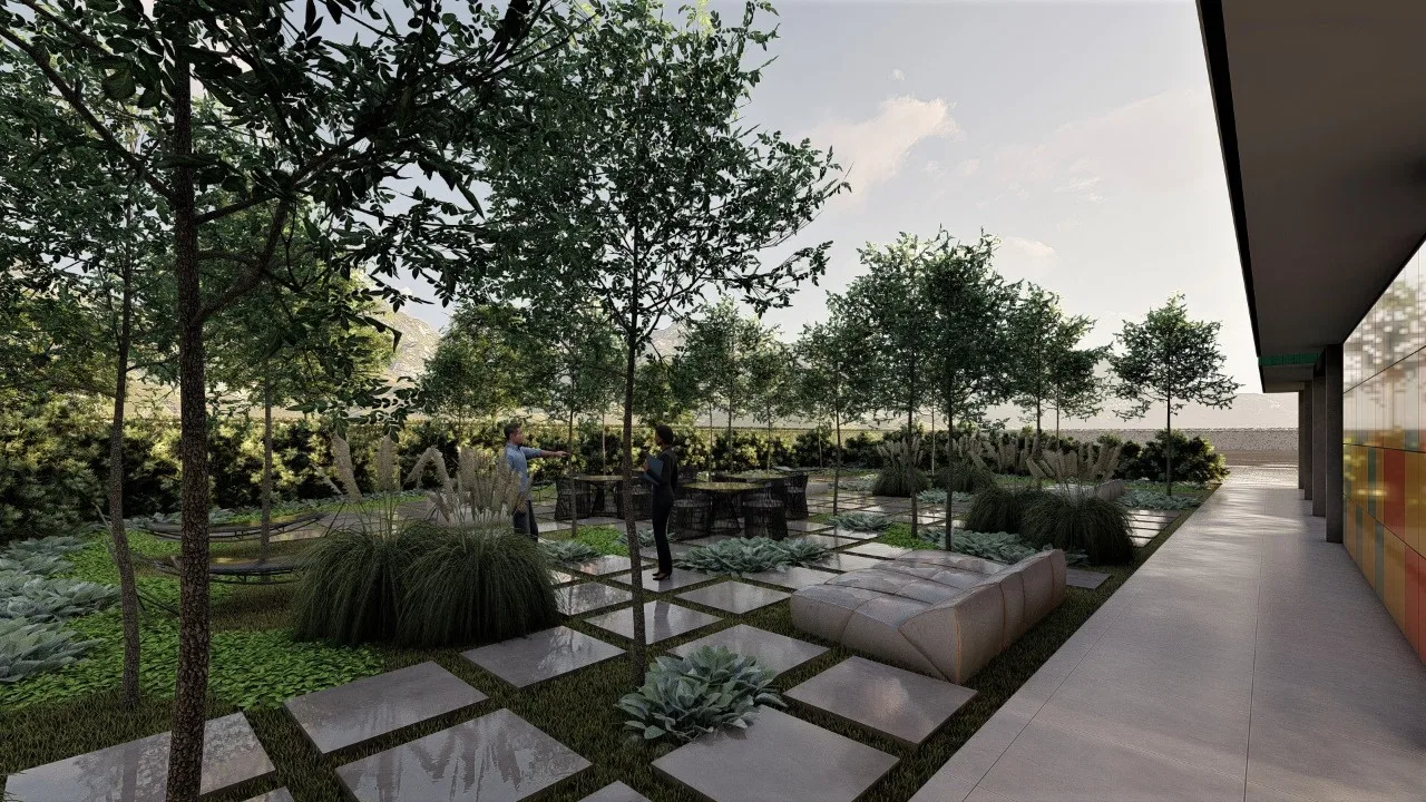 Entrance garden with a checkerboard of paving and grass, ornamental grasses and young trees, two people talking by outdoor furniture