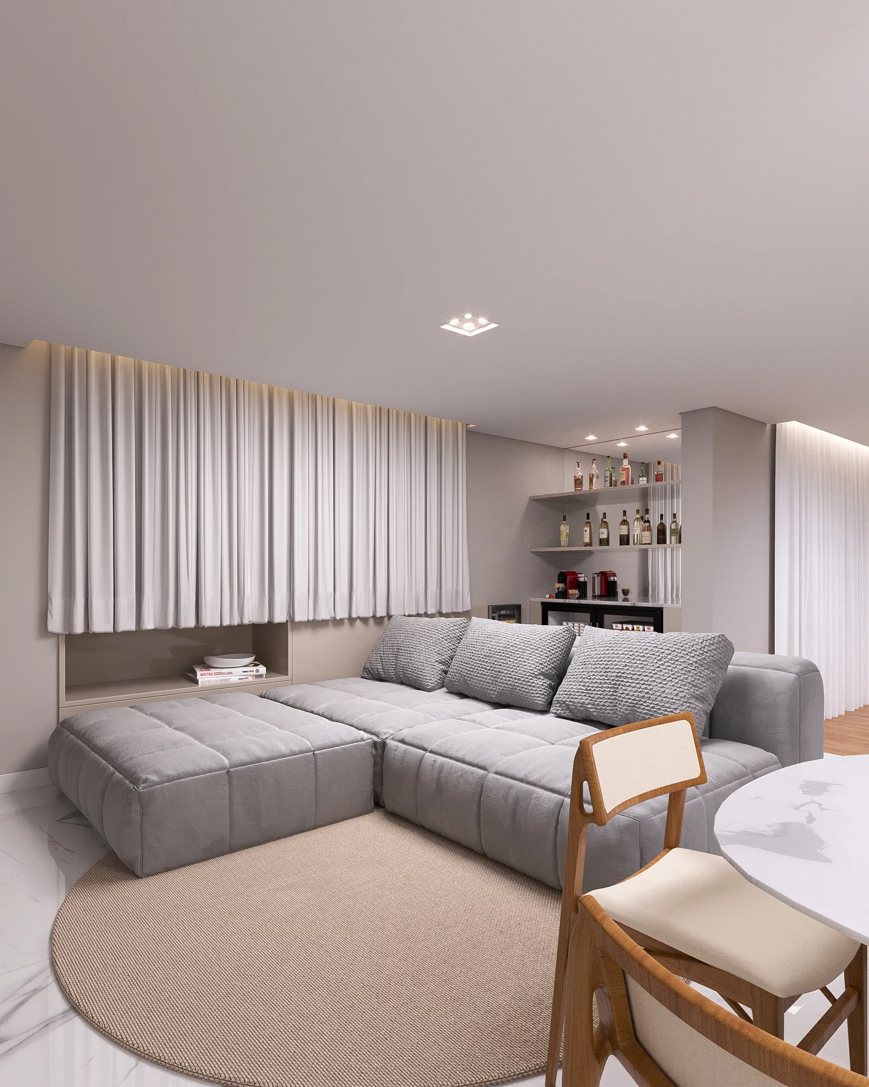 Intimate lounge with a grey modular sofa, backlit shelving with a bar and sheer curtains filtering the light