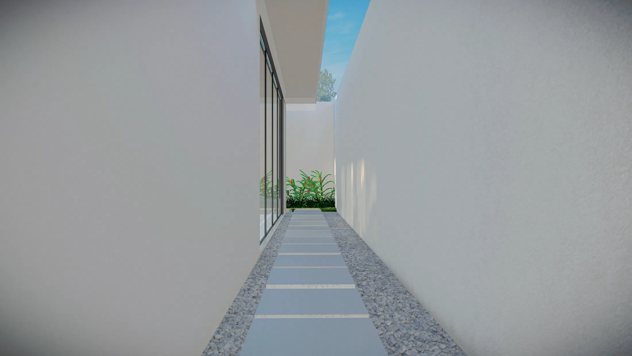 Narrow side corridor between white walls, with a slab-and-gravel path, floor-to-ceiling glazing and a small green bed at the far end under the sky.