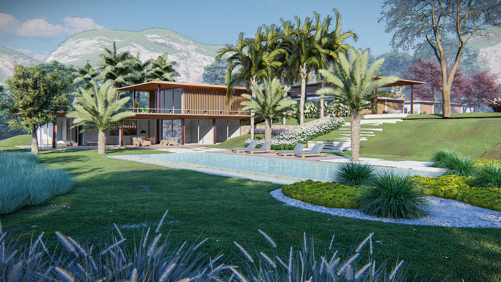 Farmhouse facade with a curved-edge pool, wooden deck and palm trees between the garden and the mountain range in the background.