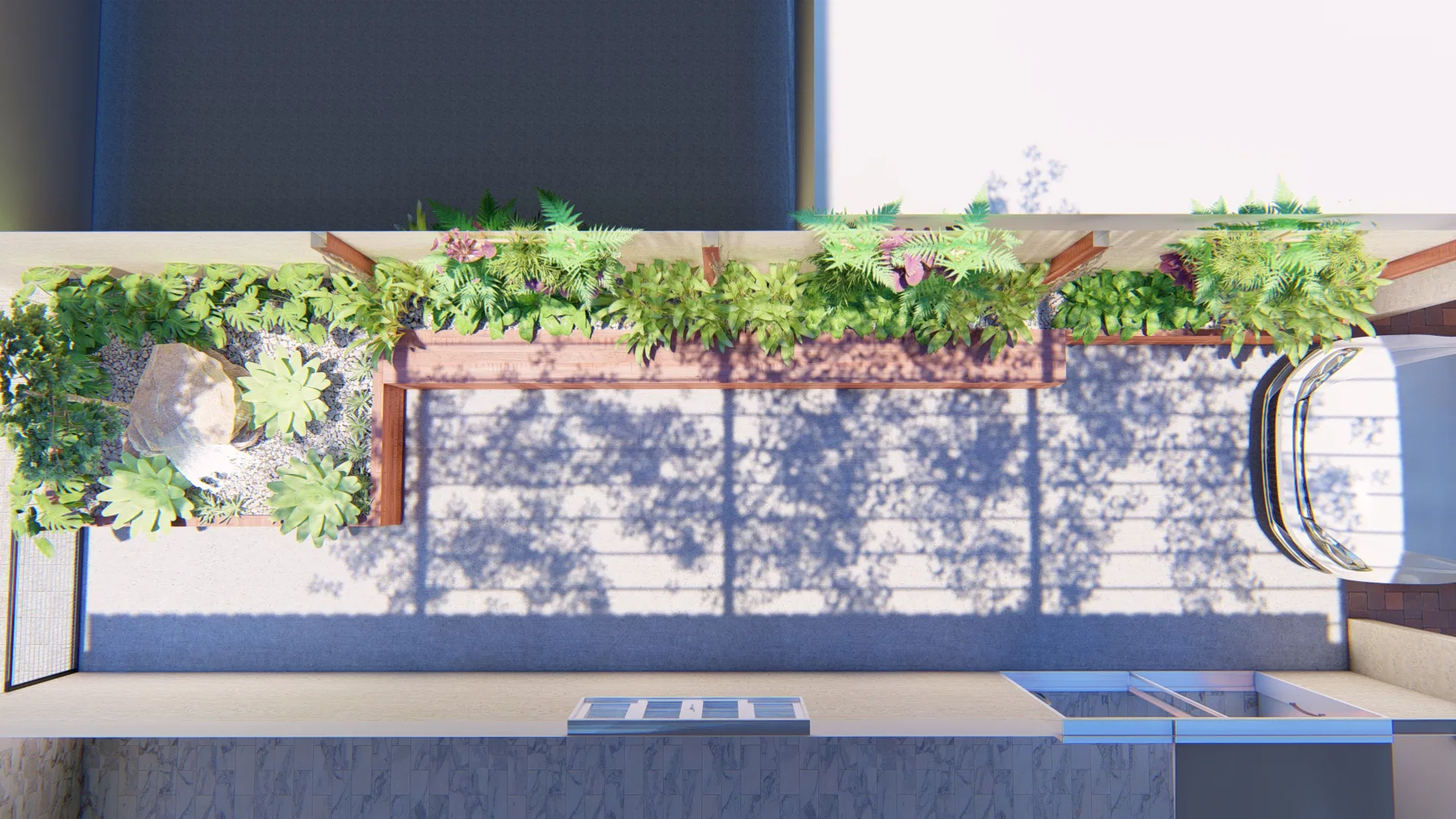 Overhead view of the courtyard showing the pergola layout, the green planters and lace-like shadows cast across the floor.