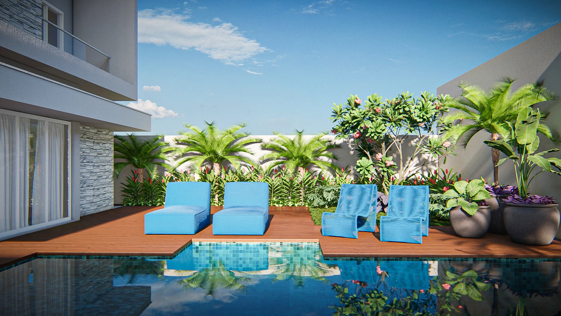 Wood deck over the pool with blue loungers and chairs, backed by palms and a small tree bearing pink blossoms.