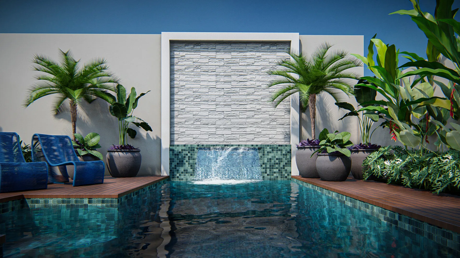 Pool lined with blue-green mosaic tiles, a white stone waterfall, wood deck, blue loungers and palms in tall planters.