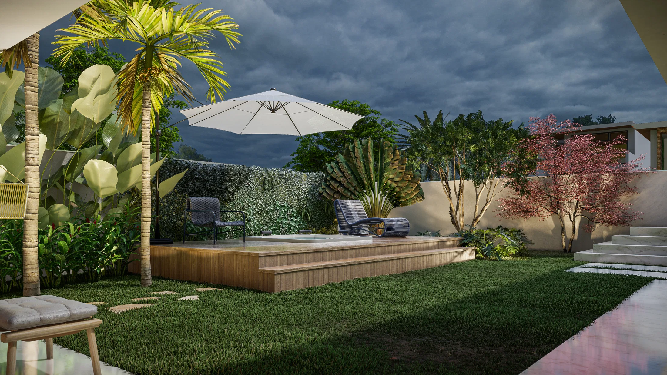 Backyard area at dusk with a tub on a wooden deck, a patio umbrella, lounge chairs and tropical vegetation around it