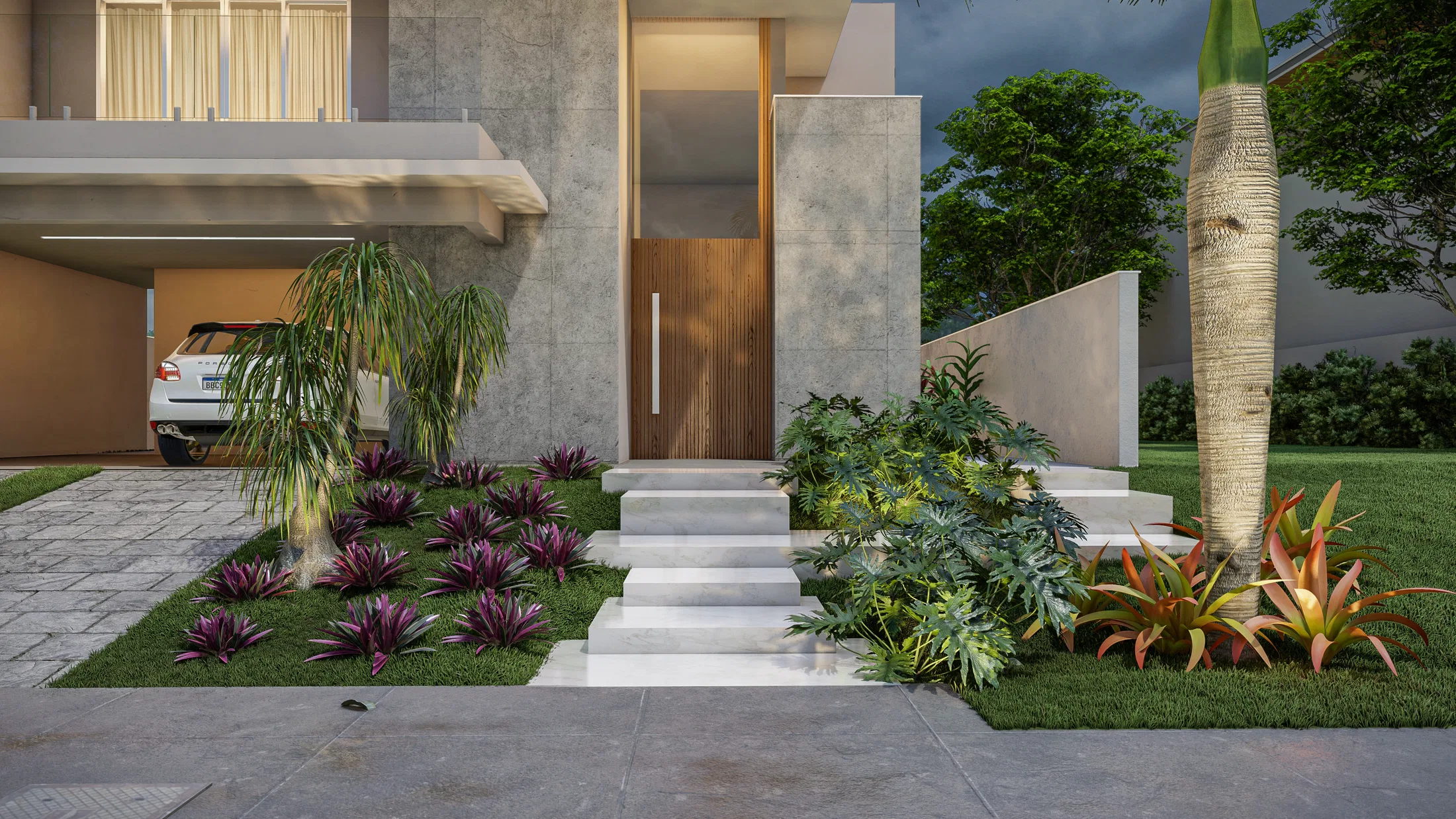 House entrance at dusk, with access stairs, a wooden door, a textured-trunk palm tree and flowering beds