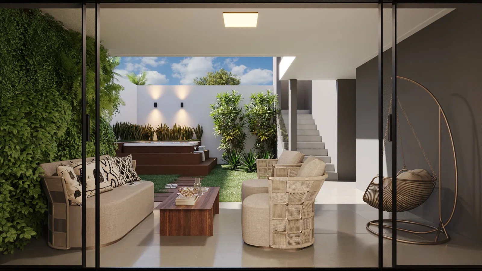 Living room opening to the patio, with pale sofa and armchairs, a wood coffee table and a hanging wicker chair beside a vertical garden