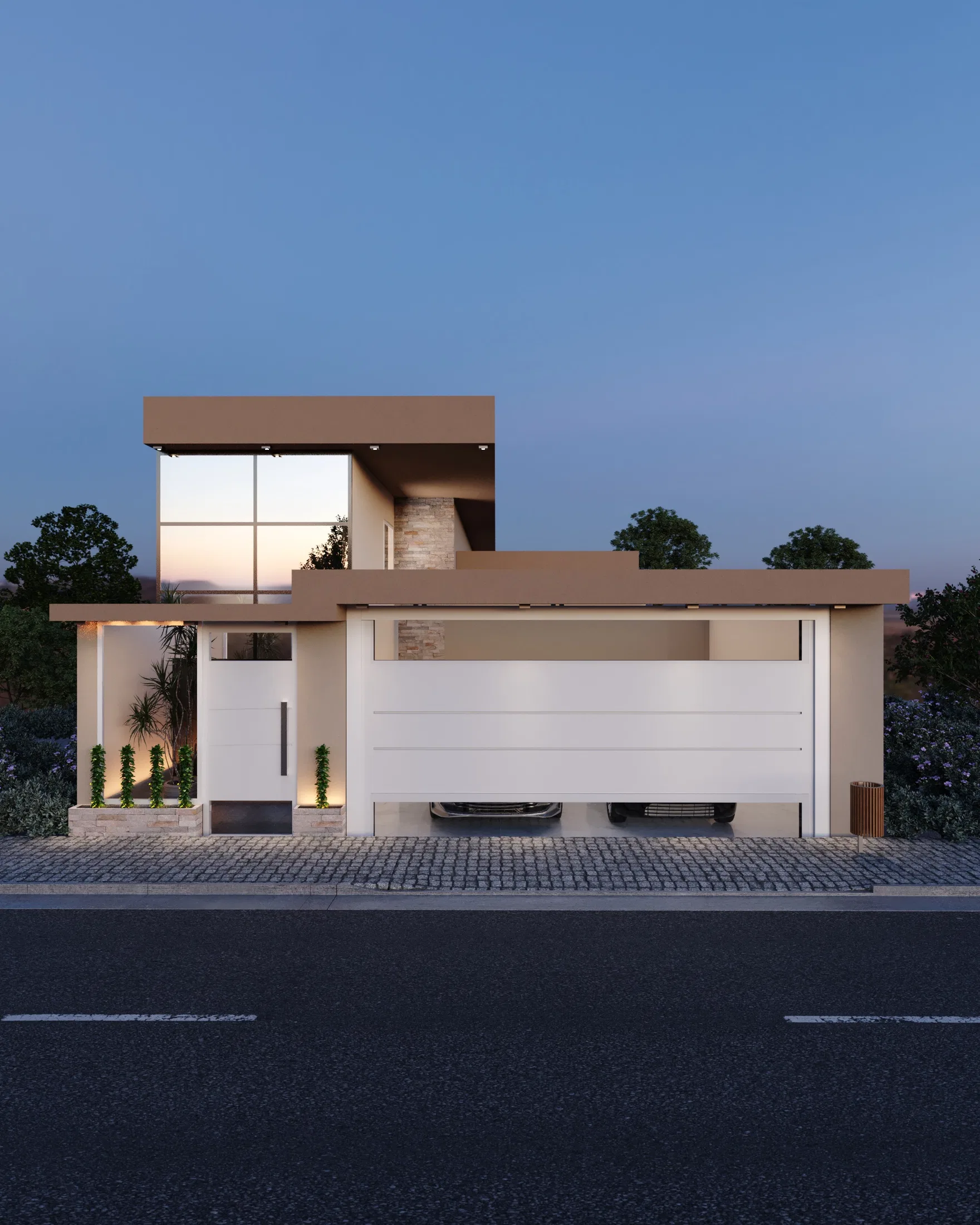 Night view of a house facade with a two-car garage, a white gate and an illuminated front garden