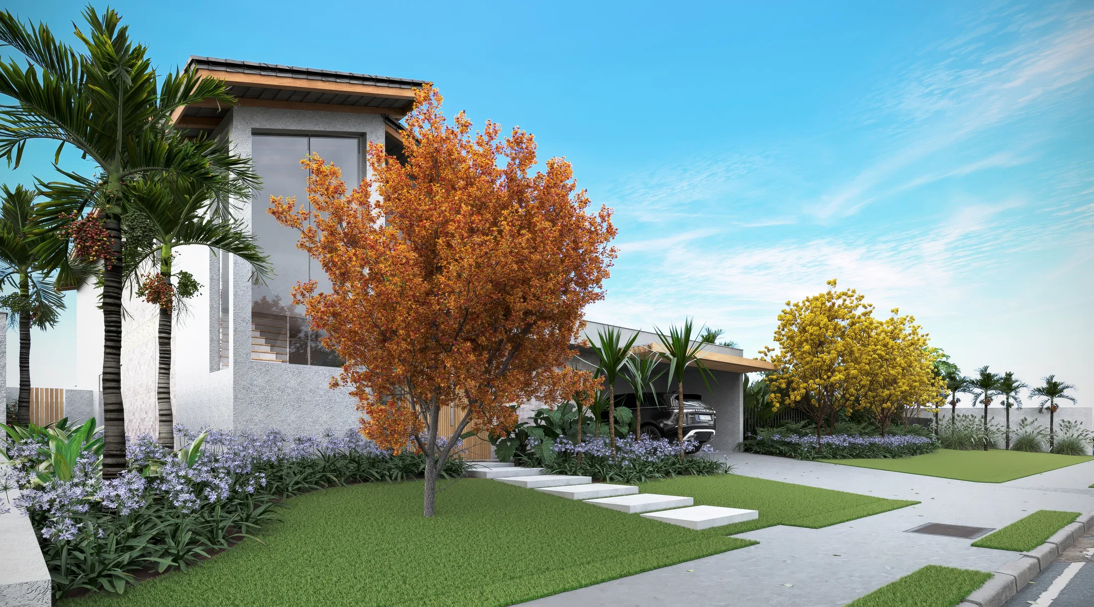 Entrance garden with an orange-leaved tree at its centre, purple flowering groundcover and a concrete stepping-stone path crossing the lawn to the carport.