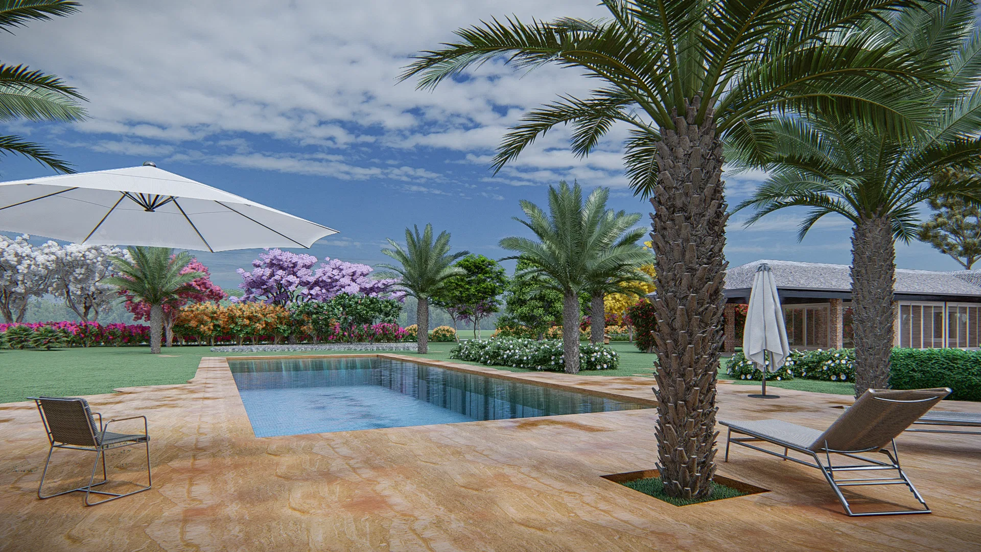 Rectangular pool deck with a sun umbrella and loungers, facing a garden in bloom with pink and yellow tones and a house beyond