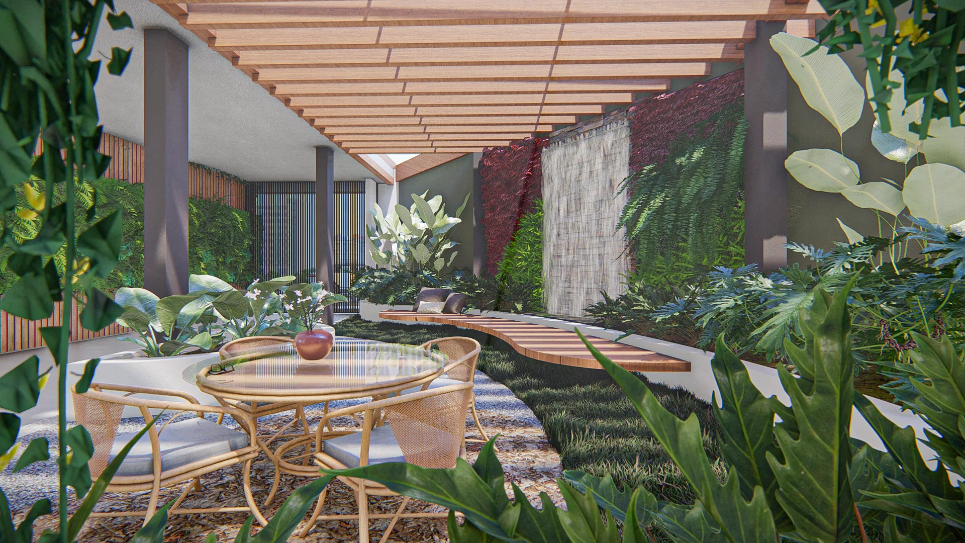 Pergola-covered patio with a stone water wall framed by red foliage and ferns, a wicker table at the center