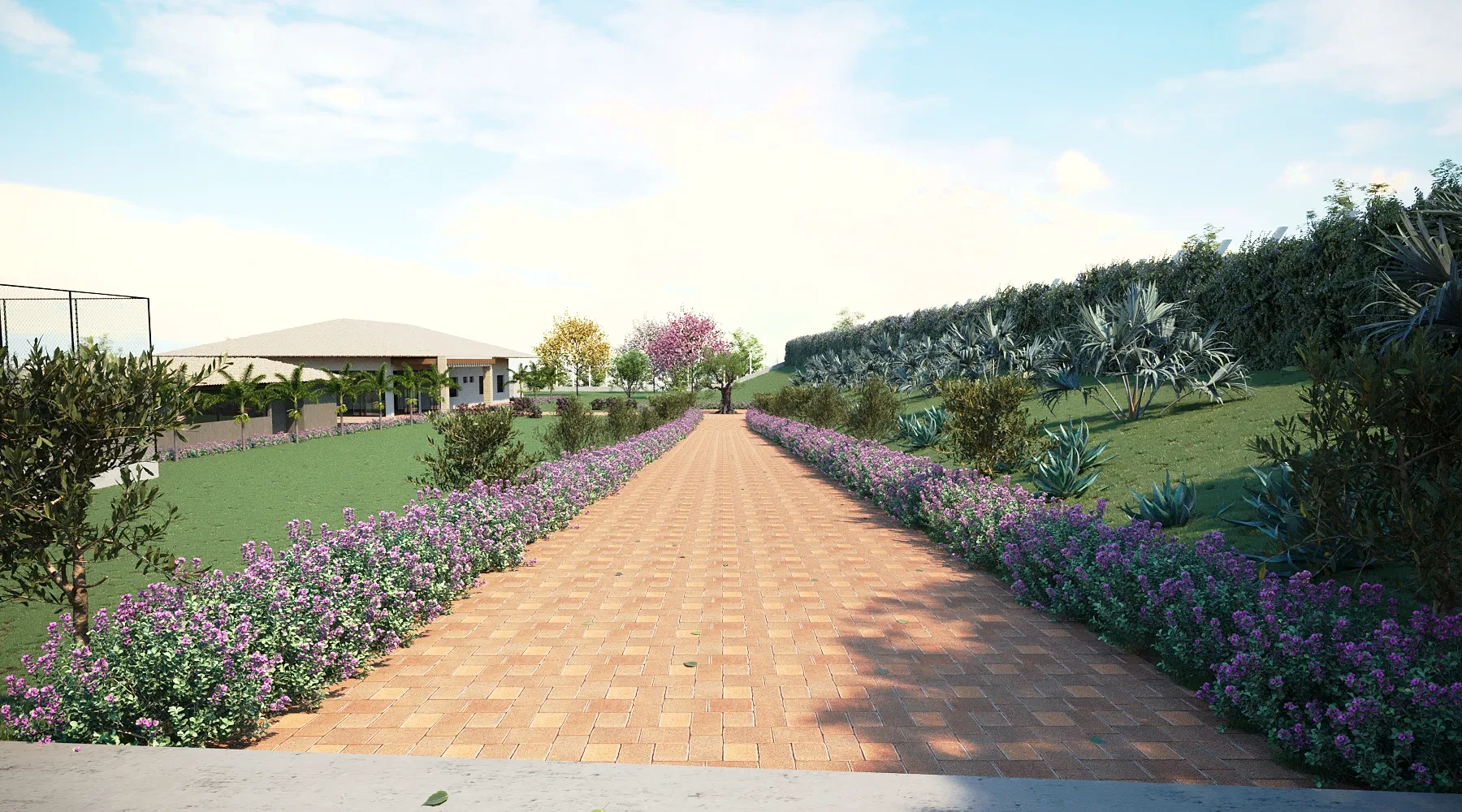 A long paved path flanked by masses of purple flowers, rising toward a covered structure over the lawn.
