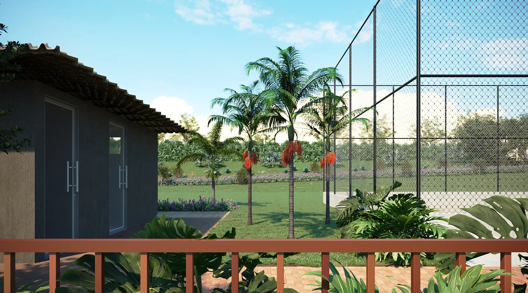 View from the deck of a small annex with dark doors and a tile roof, palms in orange bloom and the court beyond.