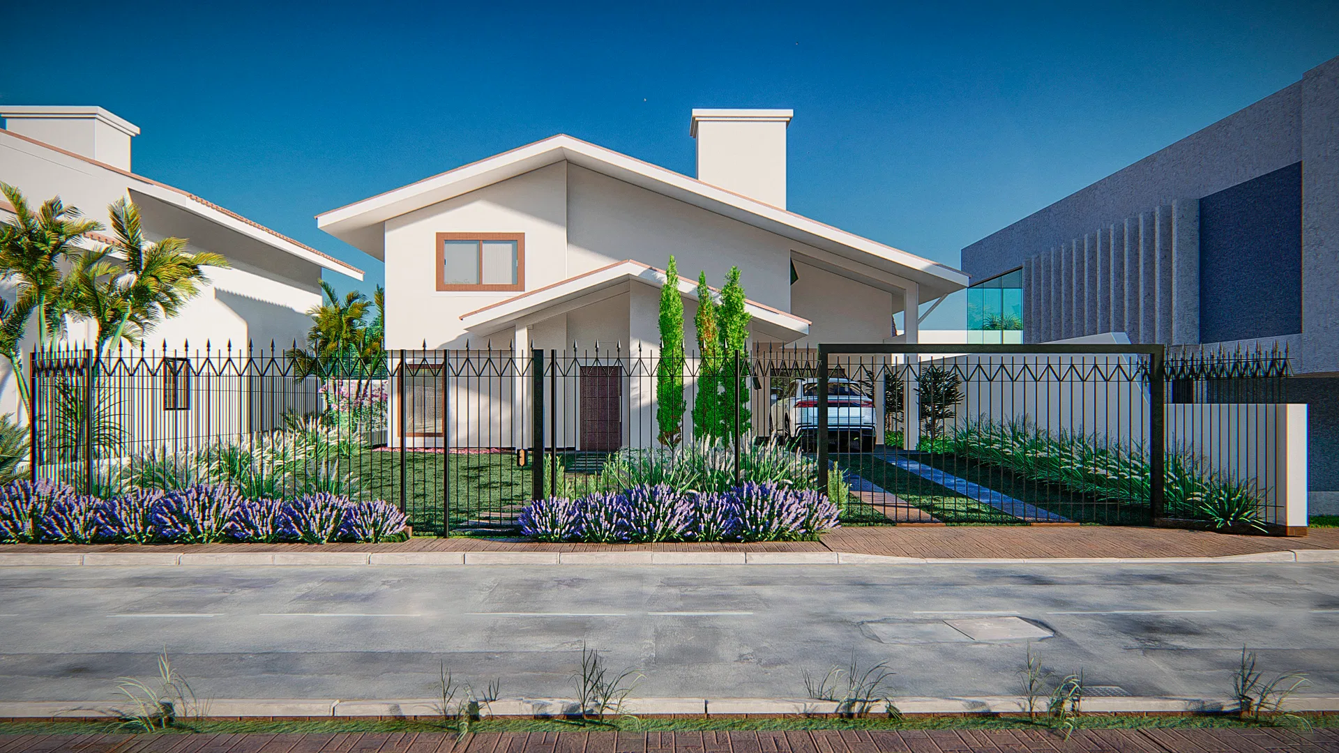 Contemporary house facade facing the street, with an iron fence, a palm tree and cypresses framing the driveway entrance