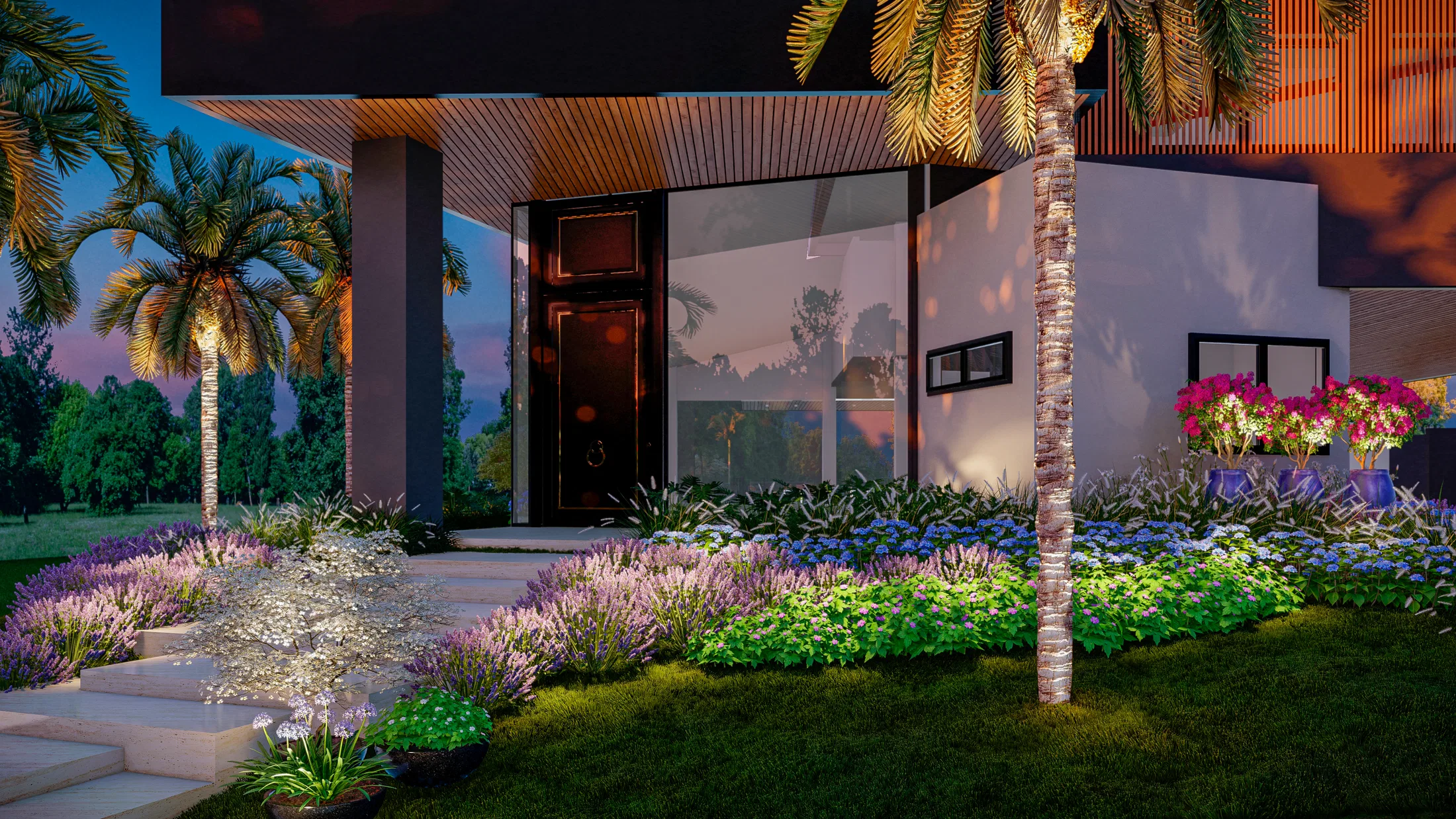 Entry facade at dusk with low lighting switched on among flowering beds and an illuminated palm tree by the door