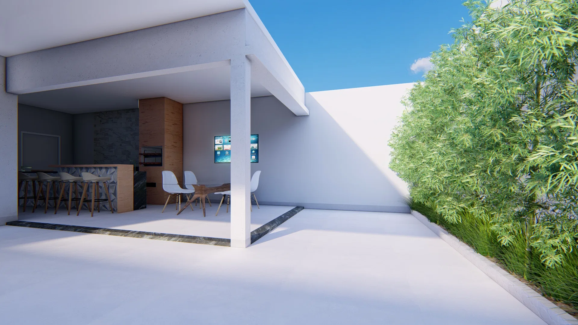 The same gourmet area from another angle, with the pergola column, counter and table under the slab, a dark pebble strip on the floor and bamboo at right